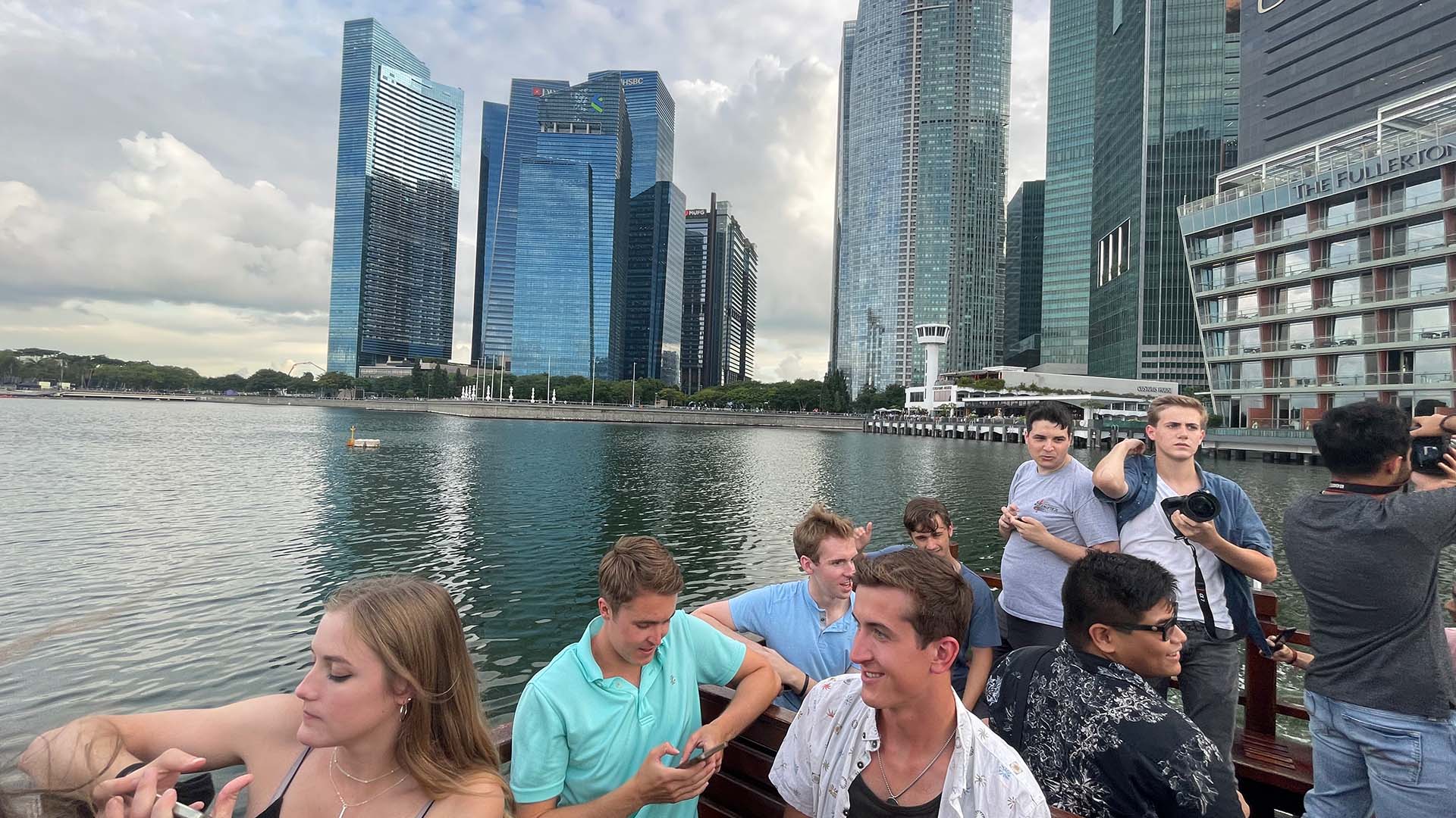 A sunset bumboat cruise on the Singapore River past Marina Bay Sands and the Merlion