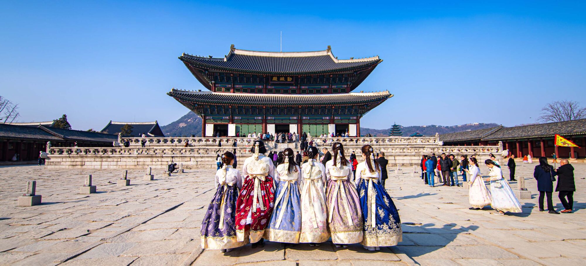Education faculty-led study abroad program in South Korea — Gyeongbokgung Palace and the Seoul skyline at golden hour