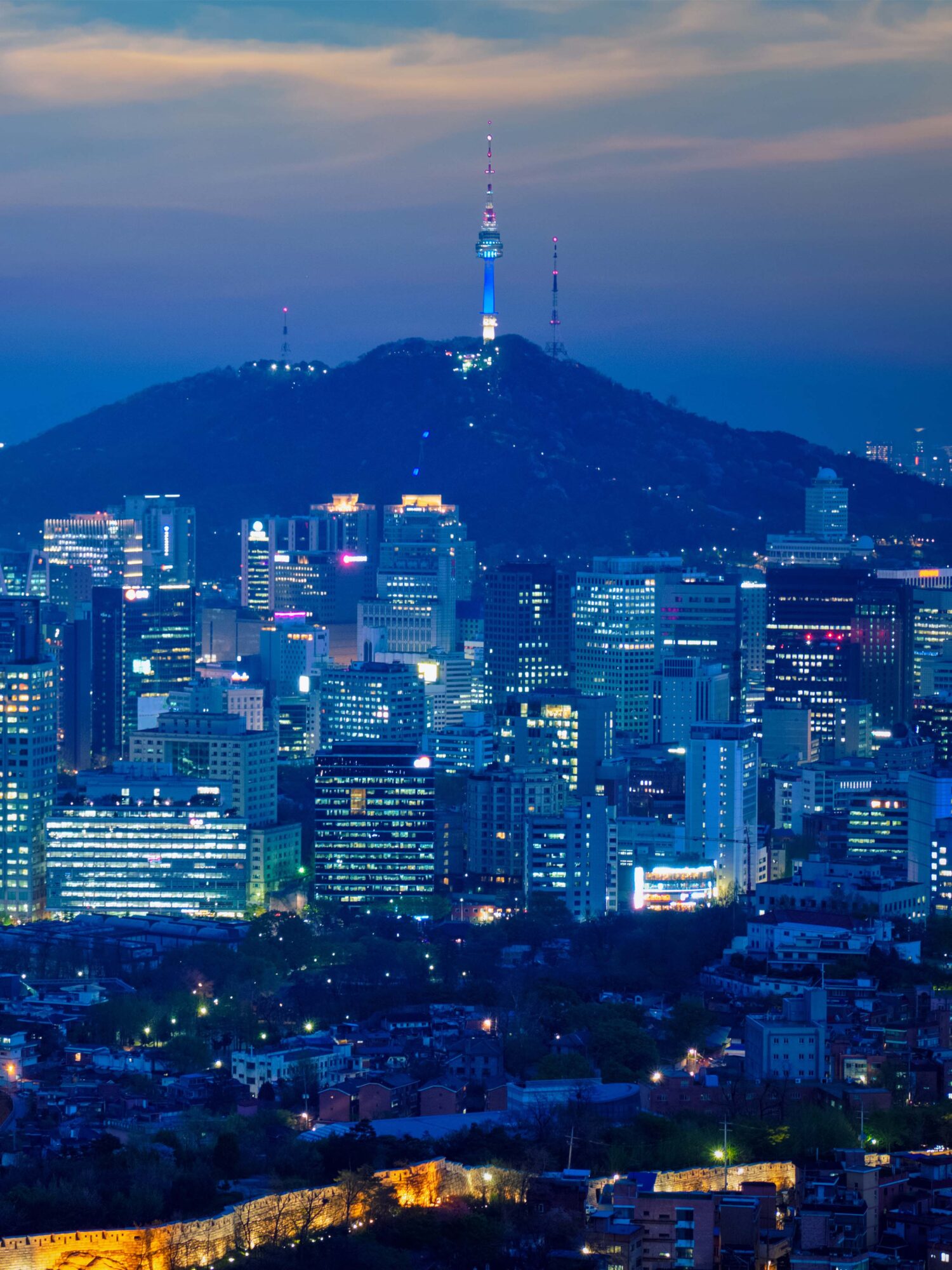 Education faculty-led study abroad program in South Korea — hanok rooftops beneath the modern Seoul skyline