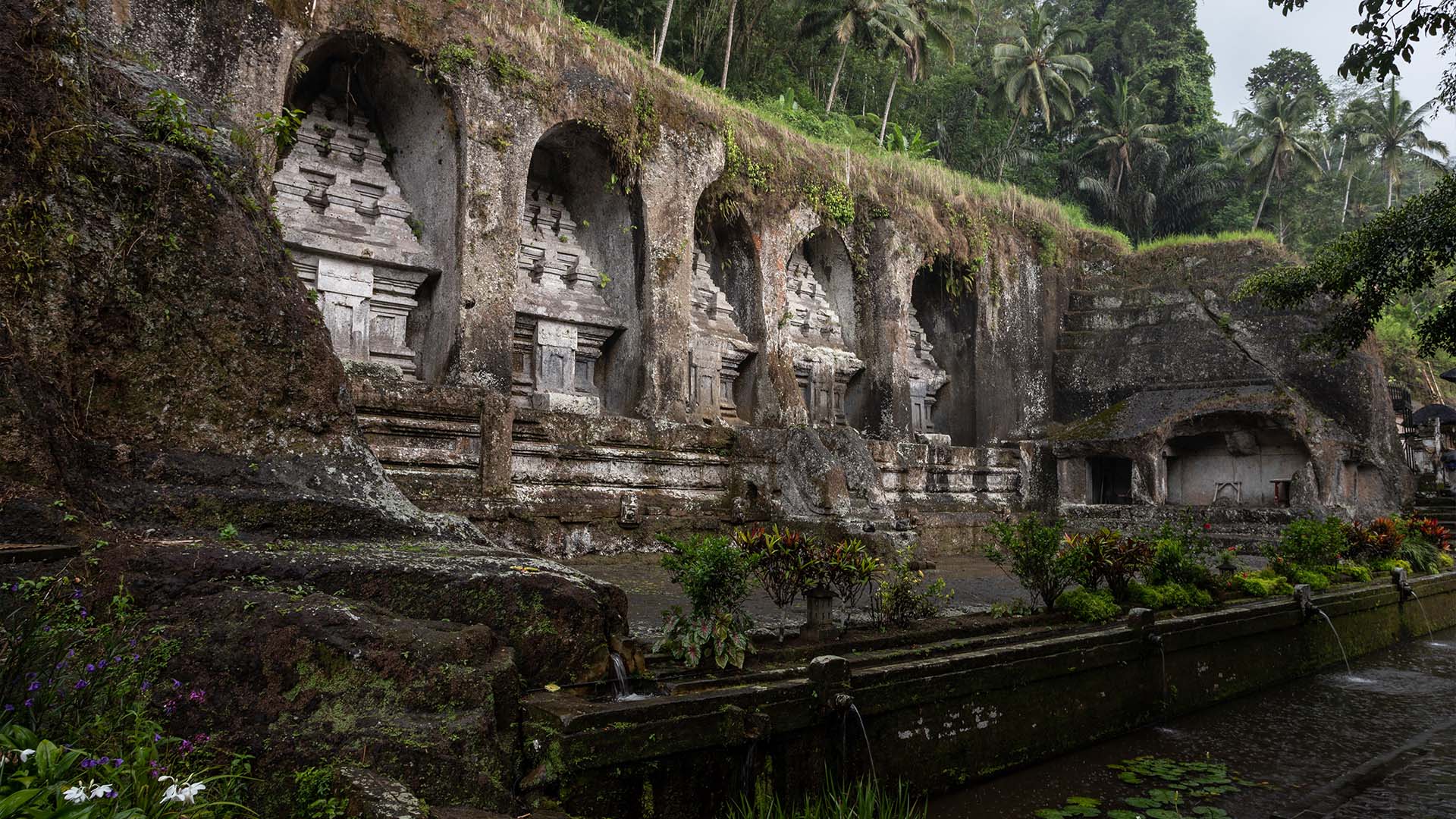 The ancient Gunung Kawi temple complex, carved into a river-valley cliff